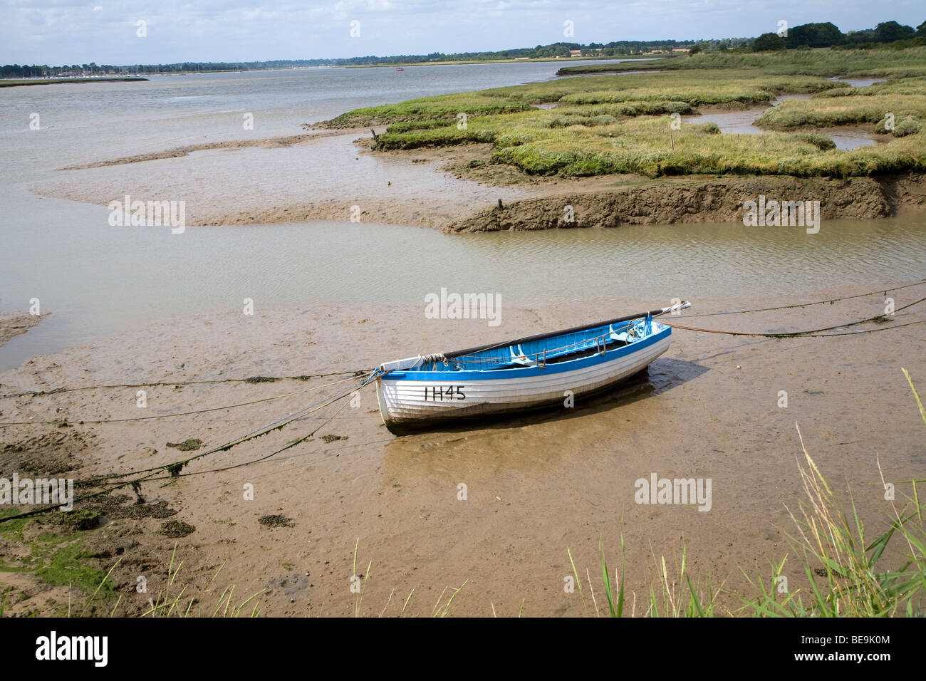 Rowing boat in mud River Deben Shottisham Creek Suffolk England Stock Photo
