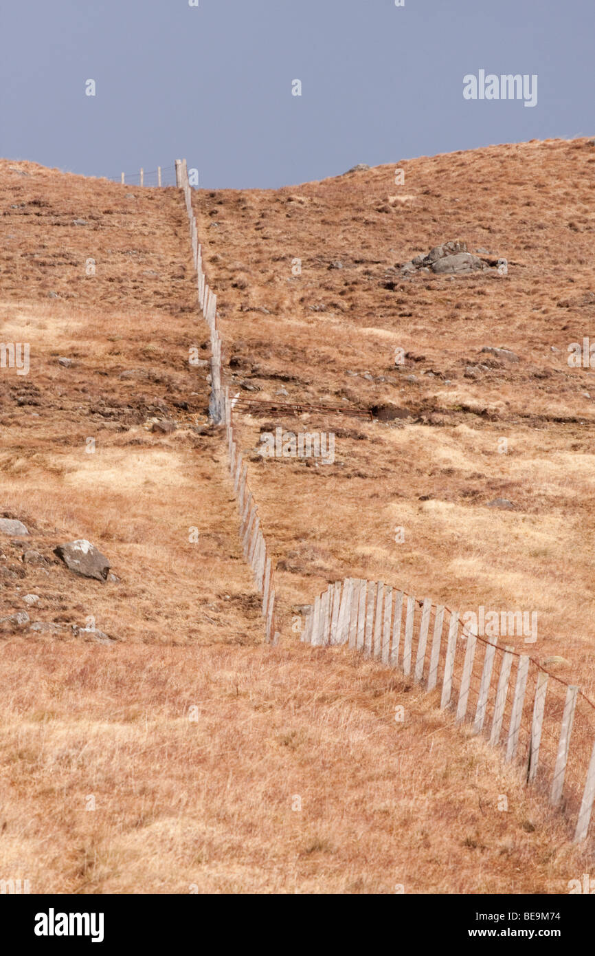 Fence crossing barren moorland Stock Photo Alamy