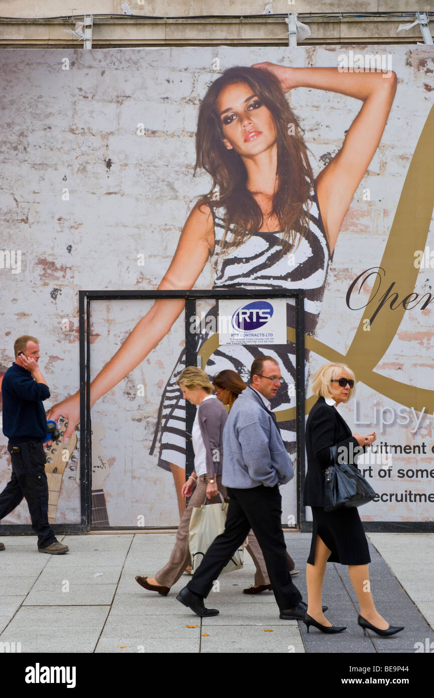 Hoarding outside Lipsy fashion store with shoppers passing in centre of Cardiff South Wales UK Stock Photo