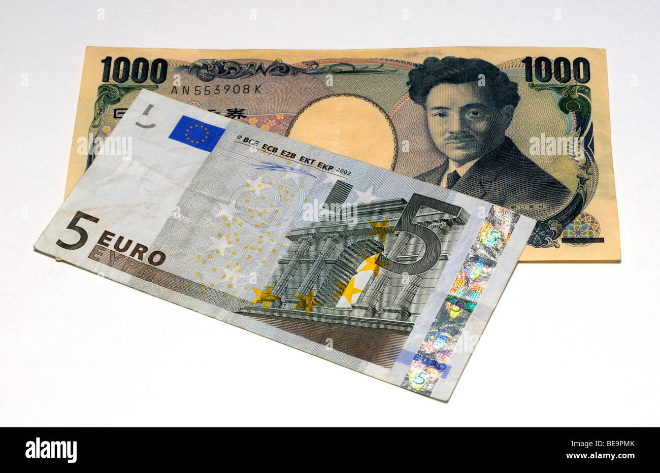 Euro and Japanese Yen Bank Notes. Stock Photo