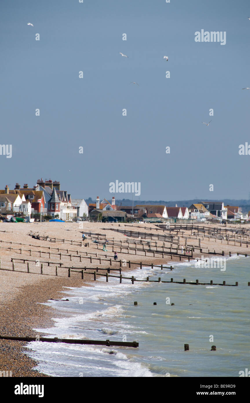 Houses on the beach, Pevensey Bay, East Sussex, UK Stock Photo