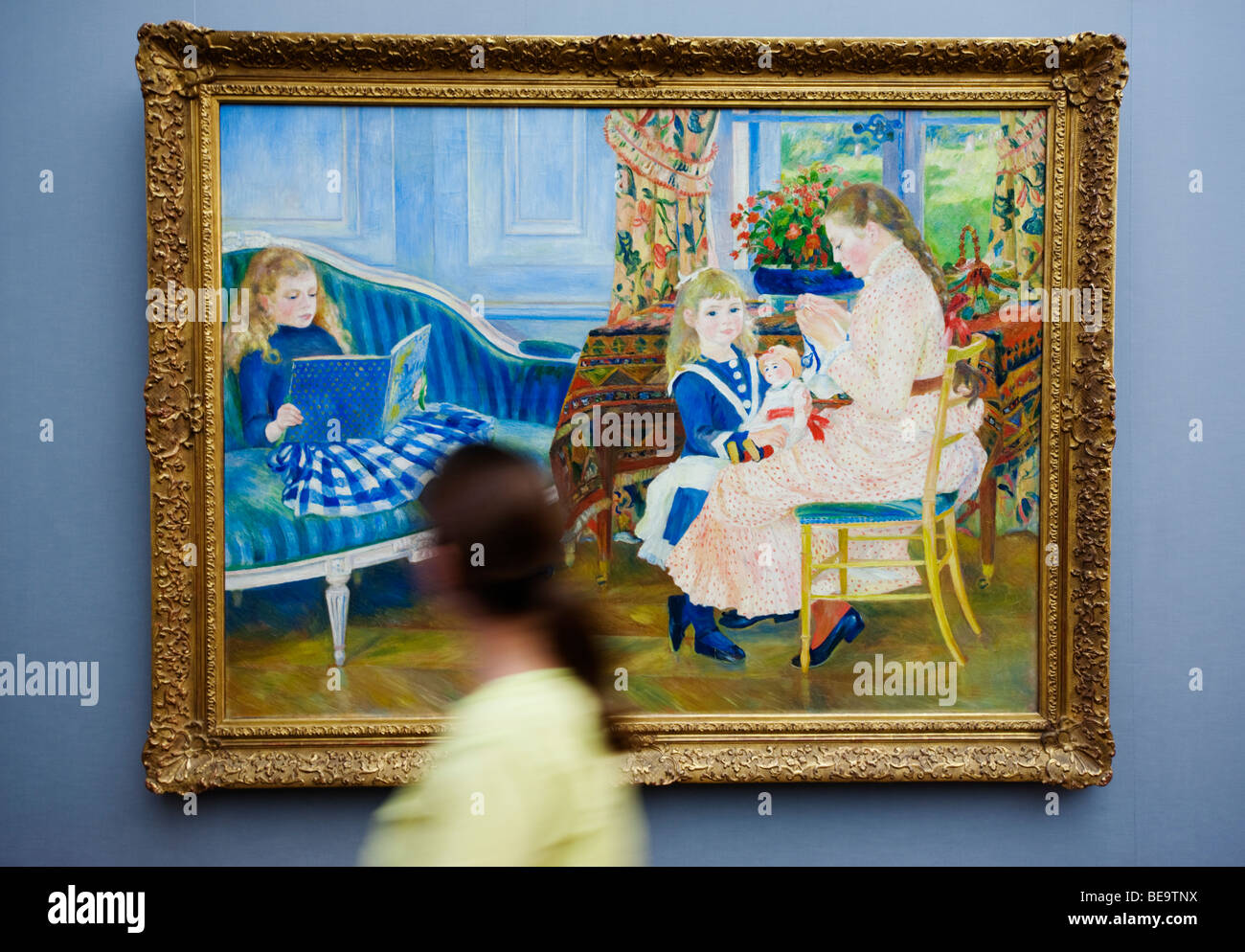 Woman looking at painting by Auguste Renoir in Alte Nationalgalerie on Museumsinsel in Berlin Germany Stock Photo