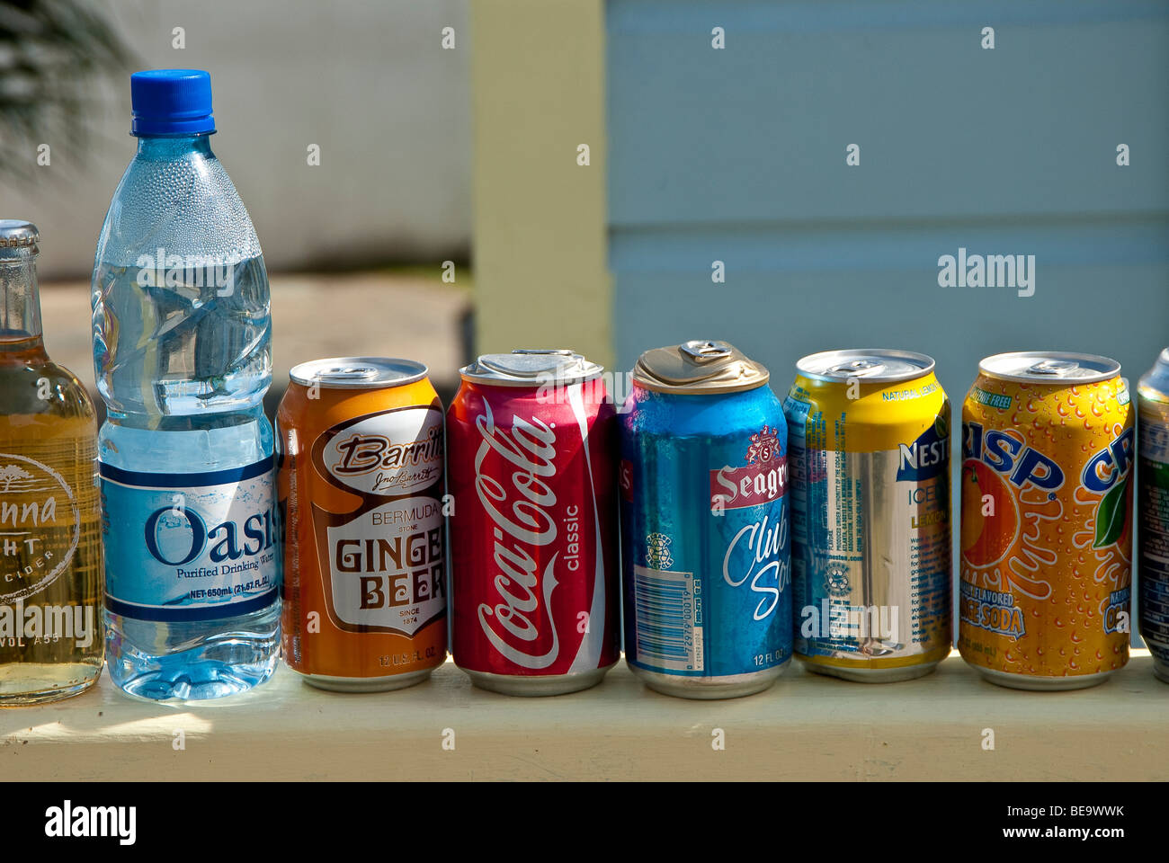 Soft drinks cans displayed for sale in a sunny tropical holiday resort