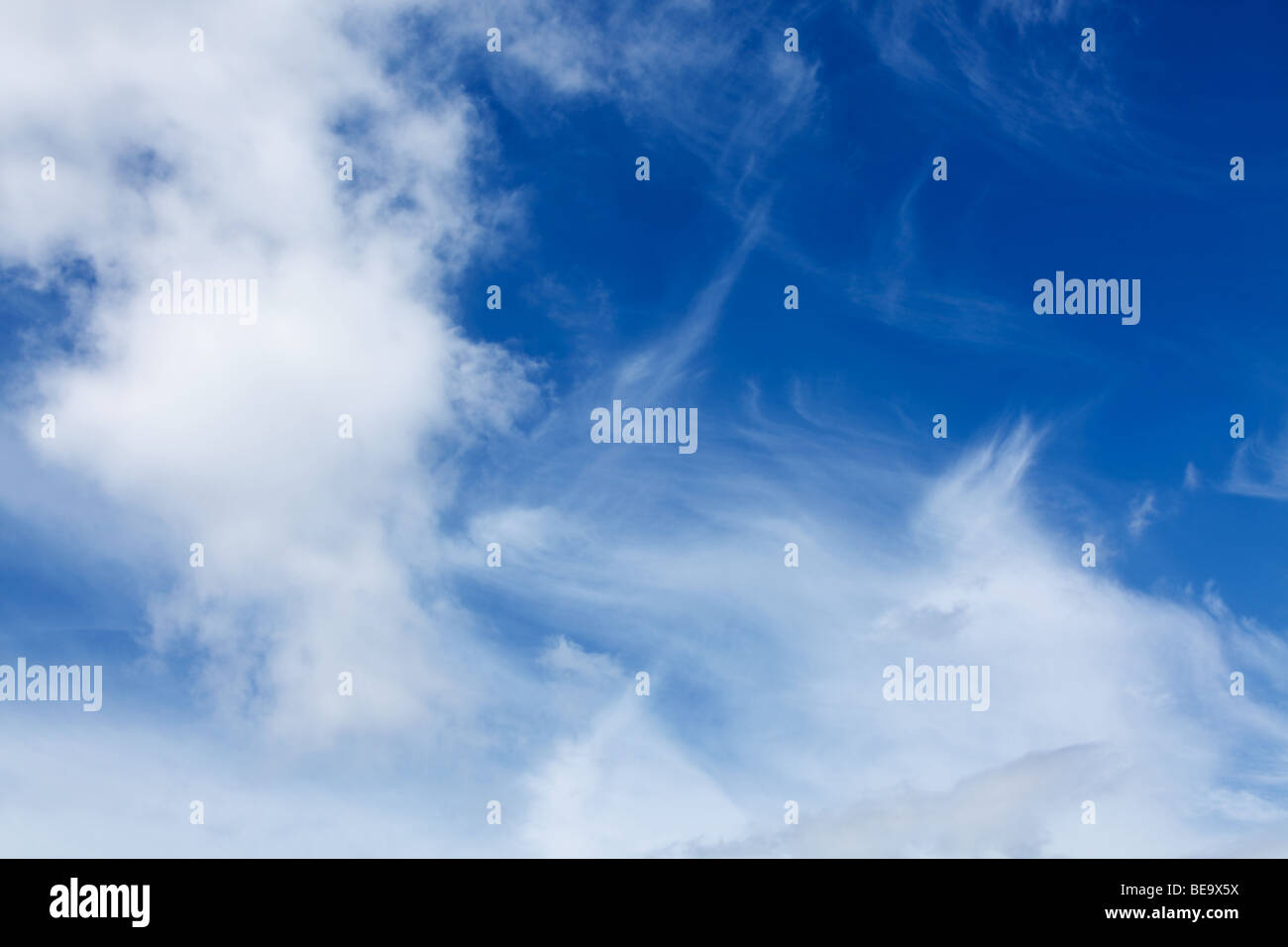 blue sky with white fluffy clouds background Stock Photo - Alamy