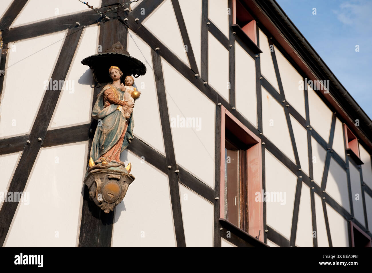 Timber framing house in Ahrweiler Germany with religious statue Stock Photo