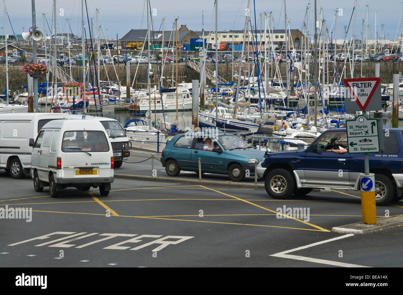 dh  ST PETER PORT GUERNSEY Cars in filter box system and road Filter signpost motor traffic channel islands intersection Stock Photo
