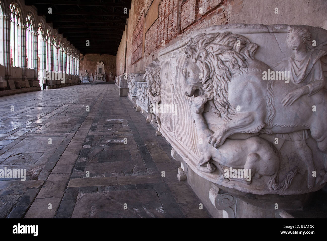 A lion killing a horse on a Marble Roman sarcophagus in the Campo Santo Monumentale ('monumental cemetery'), Pisa Stock Photo