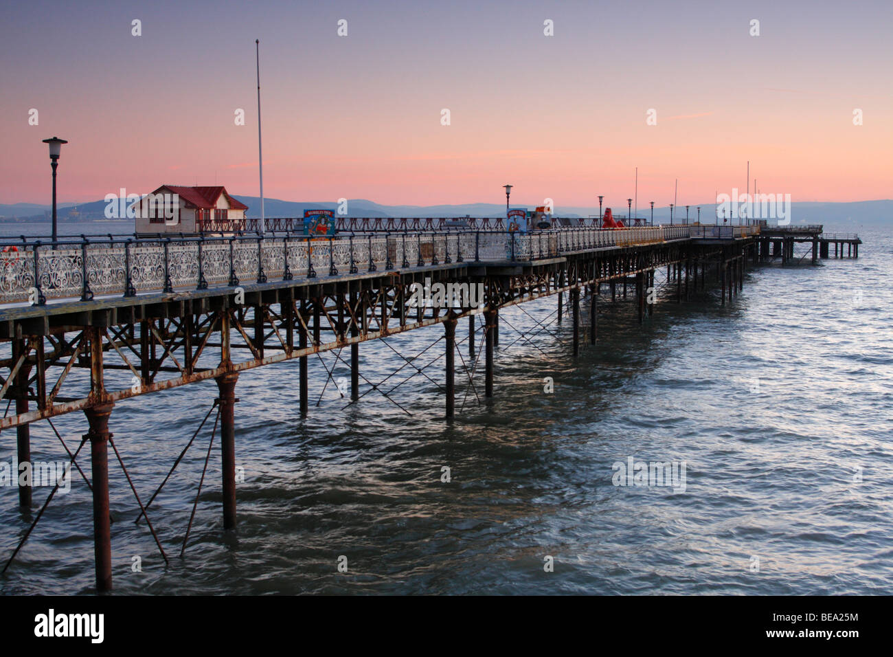 Mumbles Pier at sunrise in early morning light, Gower Peninsula near