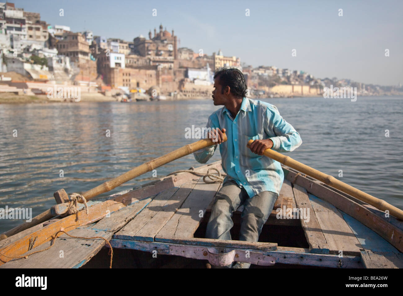 Rowboat and the Alamgir Mosque on the Ganges River in Varanasi India Stock Photo