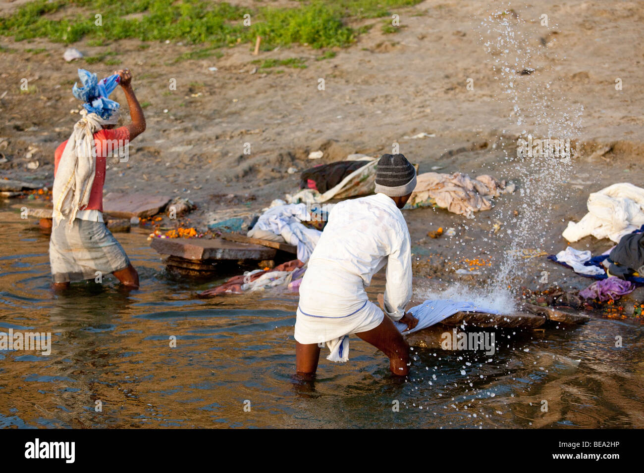 Dhobi Washing Clothes in the Ganges River in Varanasi India Stock Photo