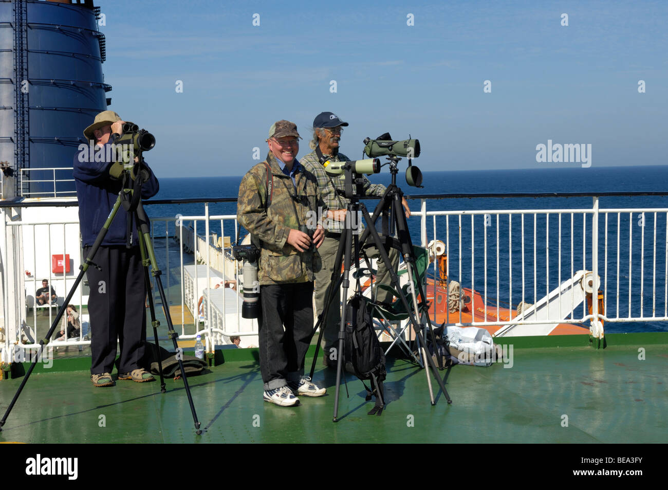 Group of passengers on deck of P&O 'Pride of Bilbao' ferry in Bay of Biscay whale watching Stock Photo
