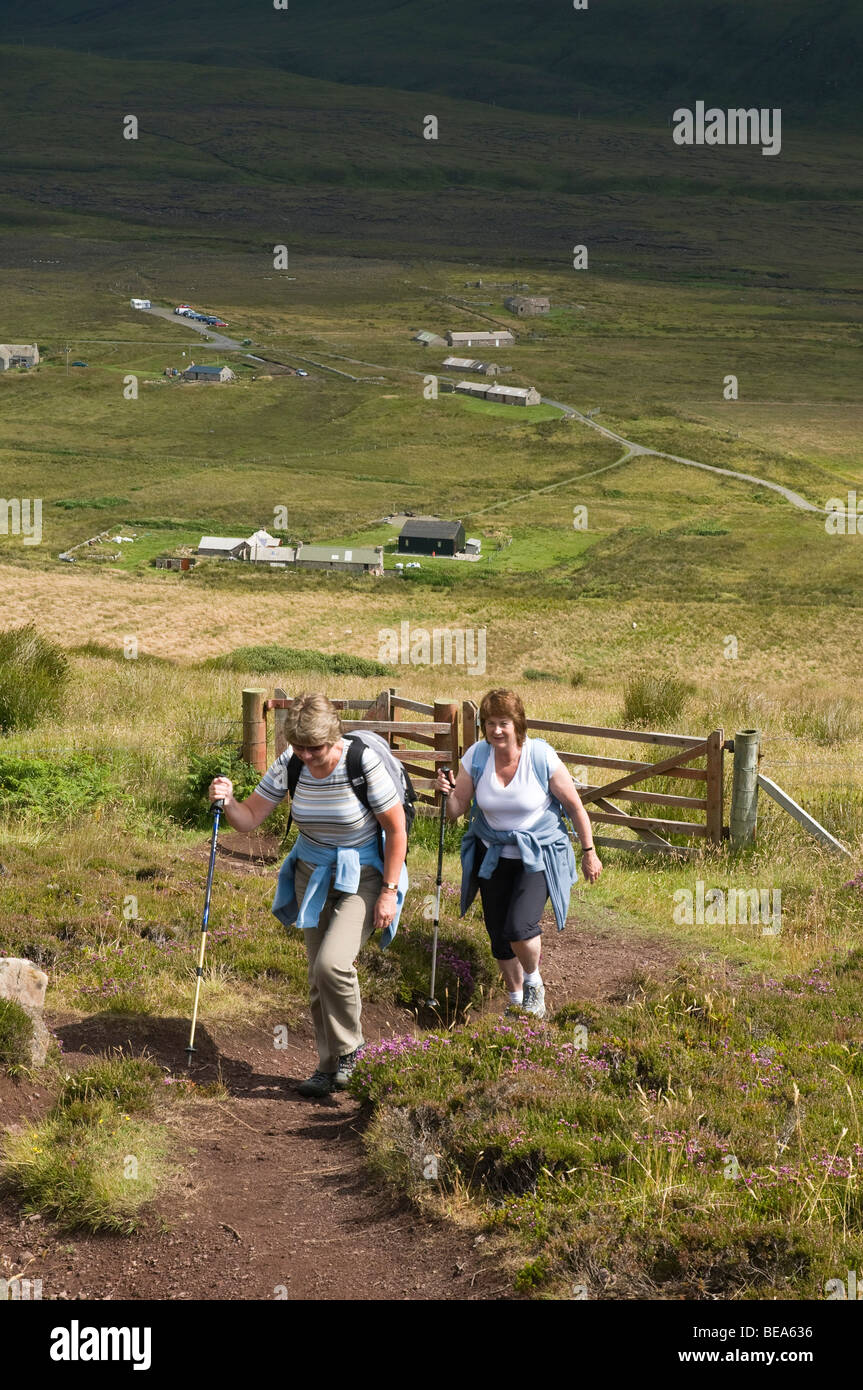 dh Scottish footpath hikers HOY ORKNEY Two senior women walking up hill ramblers uk outdoors summer people exercise hiking hills scotland islands path Stock Photo