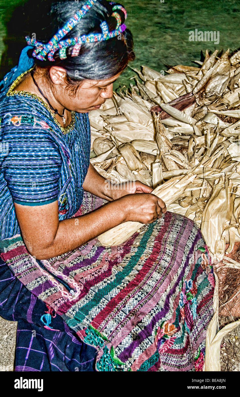 Woman separating corn in Lake Atitlan village of San Antonio Palopo Guatemala in Central America  Stock Photo