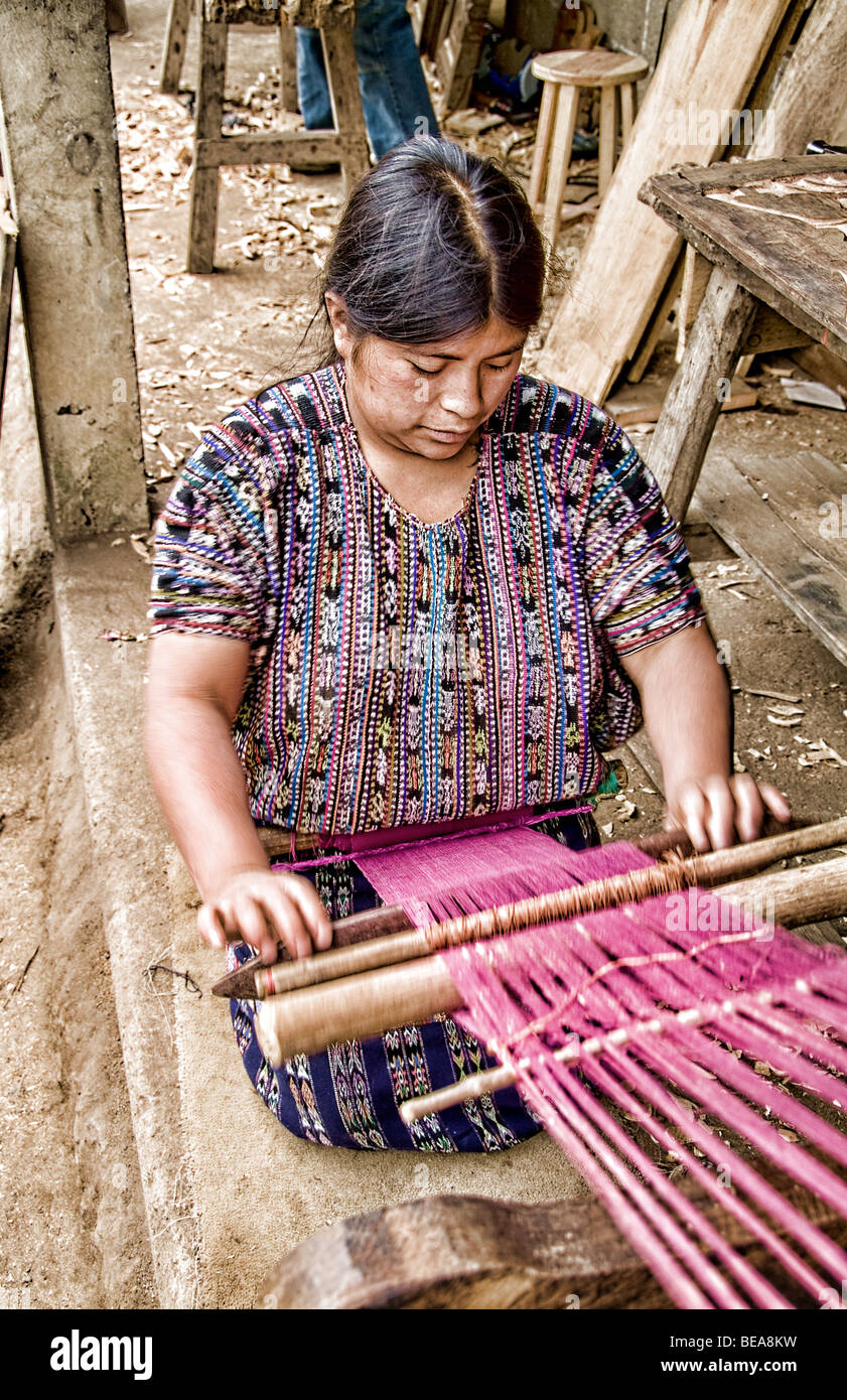 Woman weaving fabrics in small village outside of Antigua Guatemala in