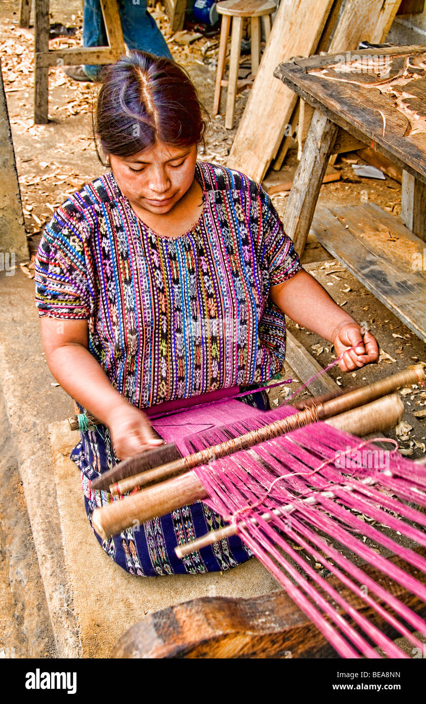 Woman weaving fabrics in small village outside of Antigua Guatemala in
