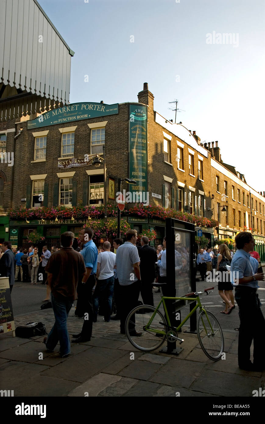 People drinking outside of pub The Market Porter next to Borough Market, London Bridge London England UK Stock Photo