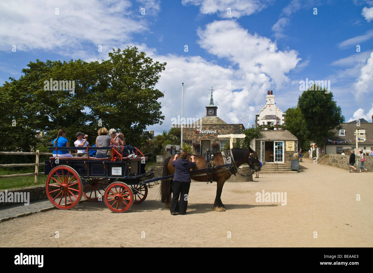 dh  SARK VILLAGE SARK ISLAND Tourists horsedrawn carriage village horse transport tourist attraction buggy Stock Photo
