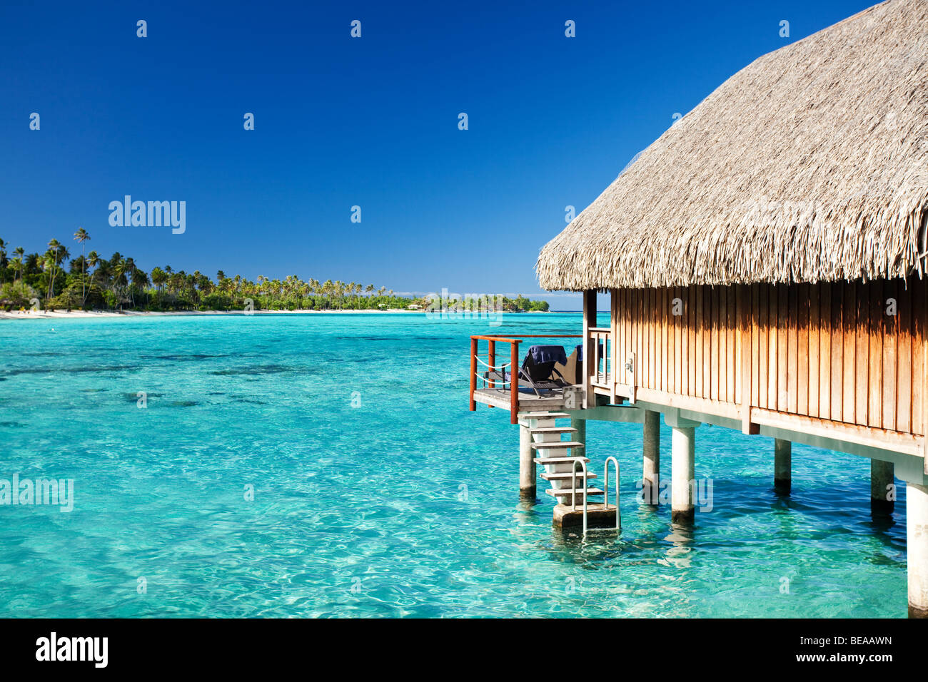 Over water bungalow with steps into amazing lagoon Stock Photo