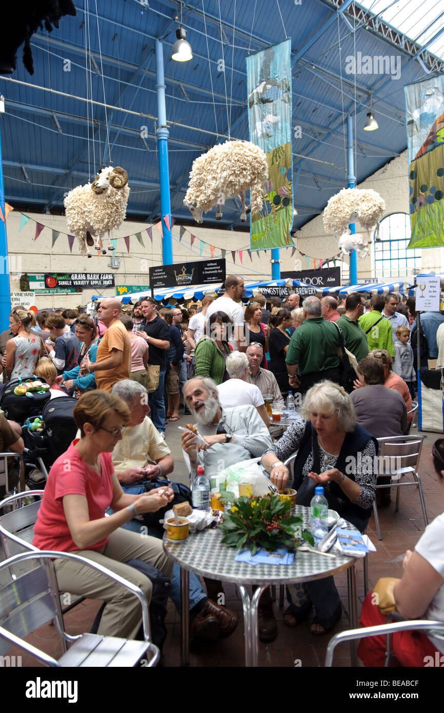 Crowds of visitors eating and drinking in the Market Hall at the