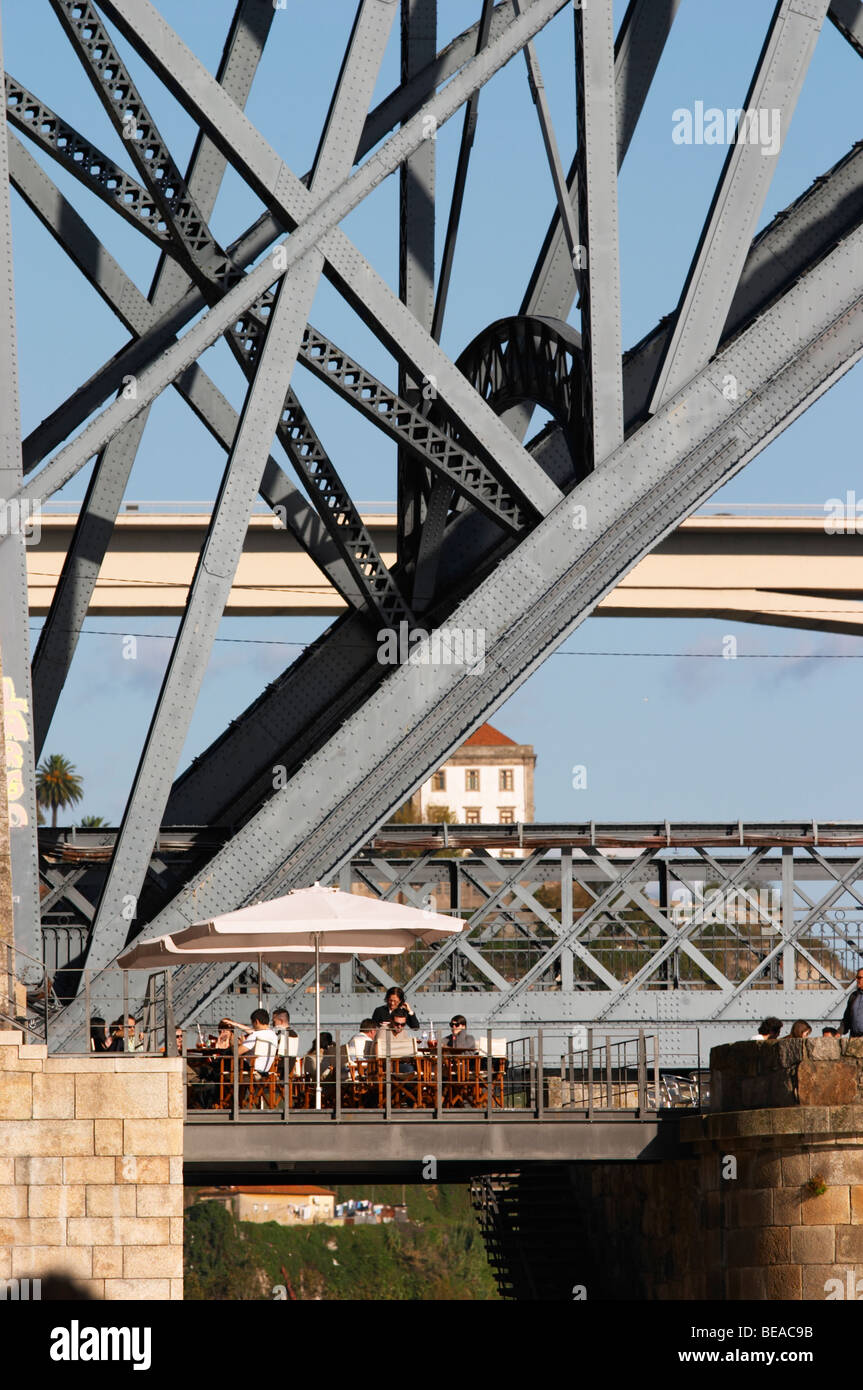 Dom Luis I bridge seen from Cais da Ribeira restaurant terrace porto portugal Stock Photo