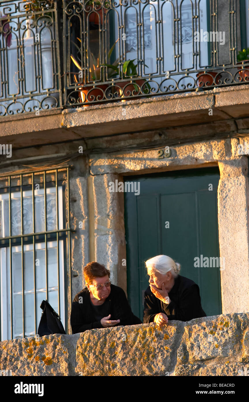 two old ladies talking cais da ribeira porto portugal Stock Photo