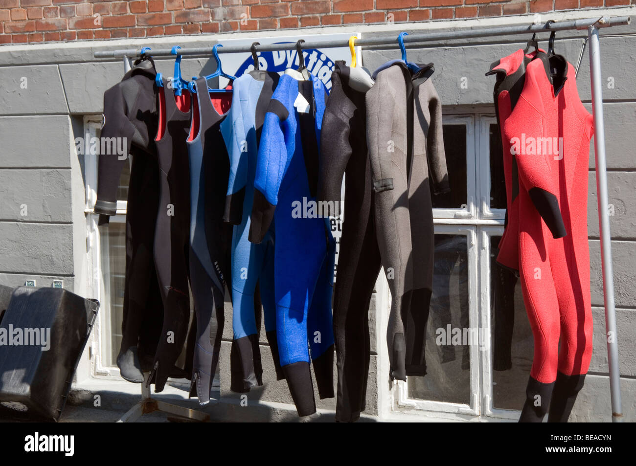 wet suit suits wetsuit wetsuits diving diver divers neoprene school party group lesson learning to learn instructor Stock Photo