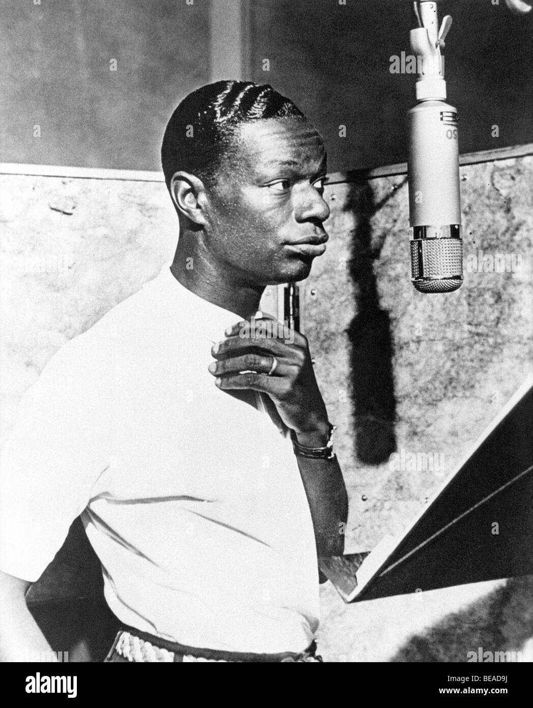 NAT KING COLE US singer in a recording studio Stock Photo Alamy