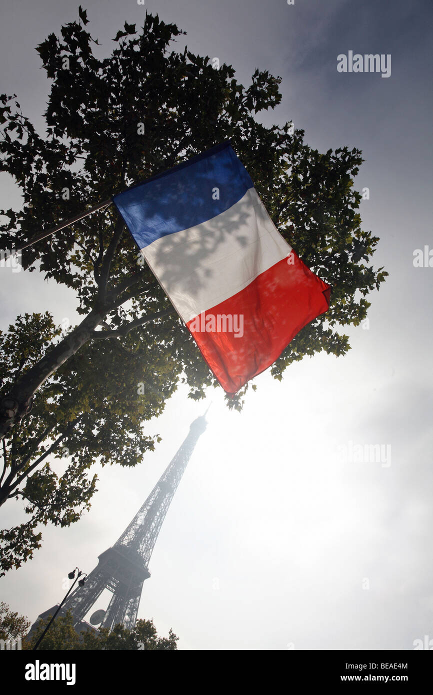 The flag of France with the Eiffel Tower in the background, Paris