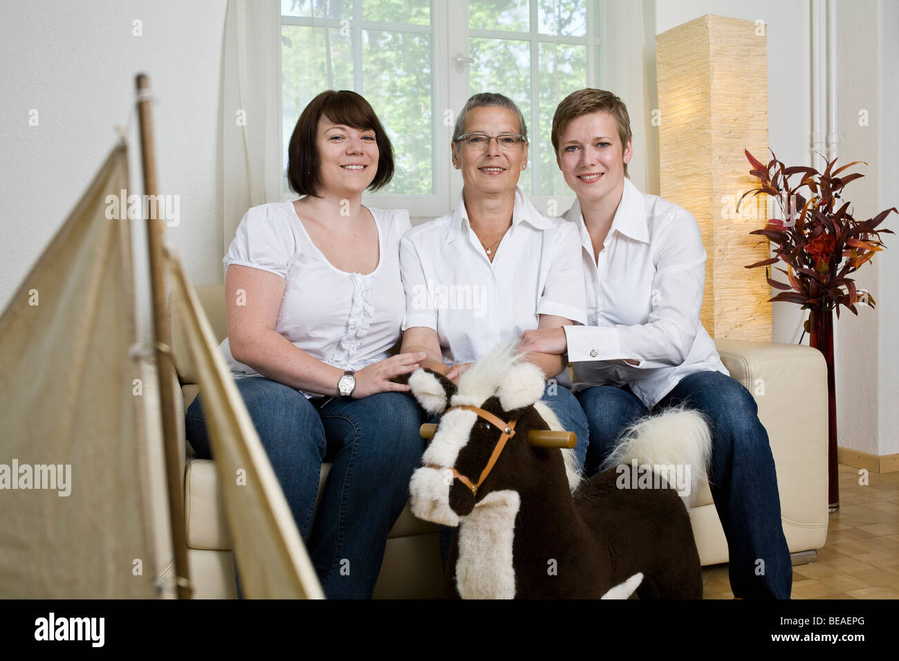 Formal portrait of a mother and her two daughters Stock Photo