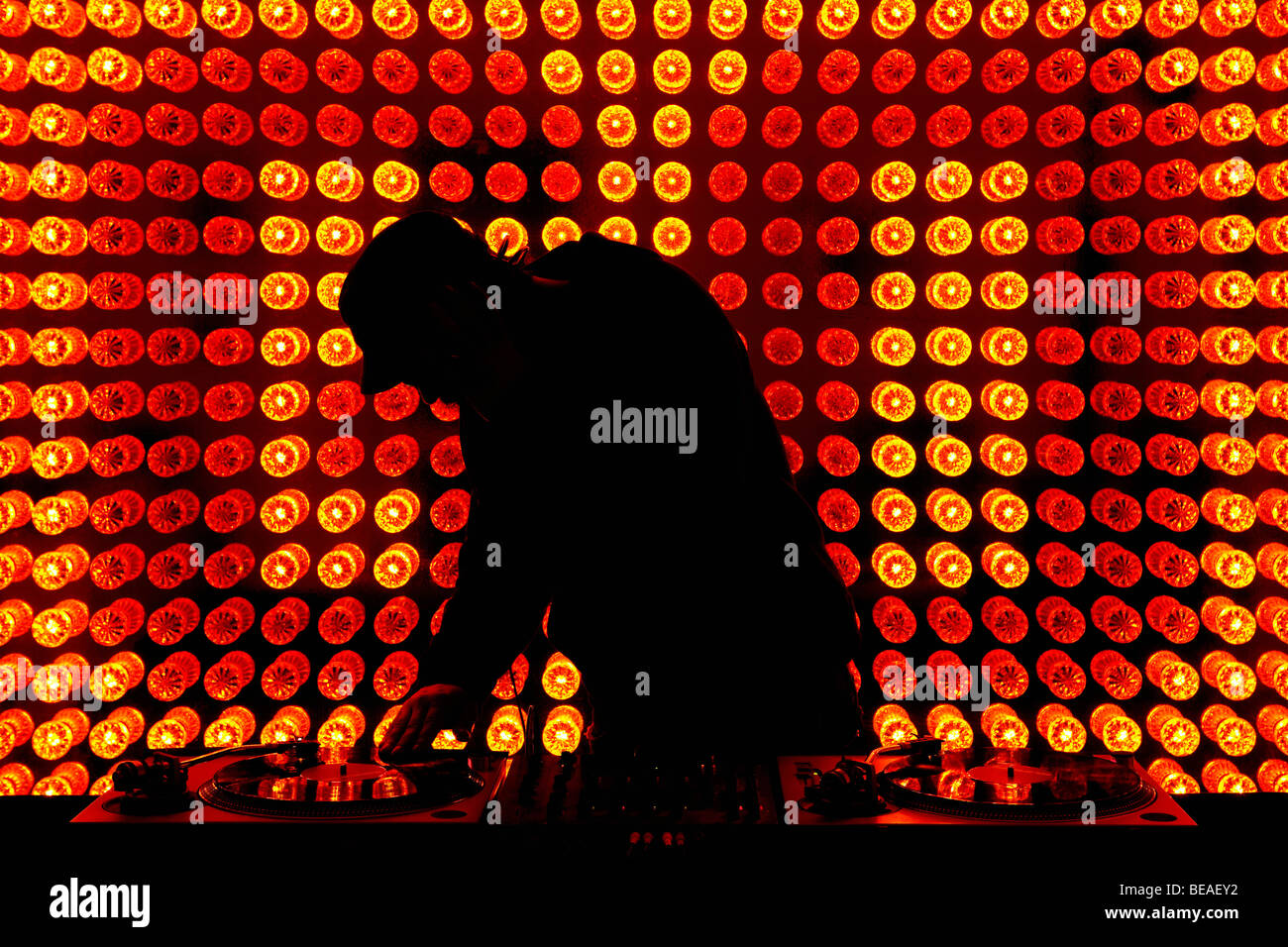 A DJ scratching a record in a nightclub Stock Photo - Alamy