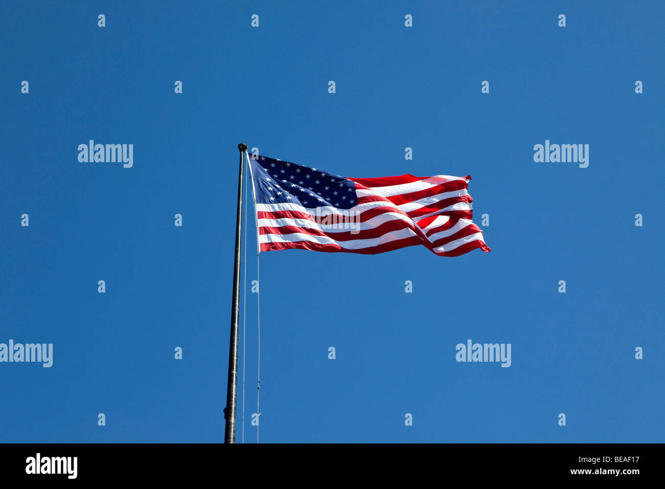 American flag flying Stock Photo - Alamy