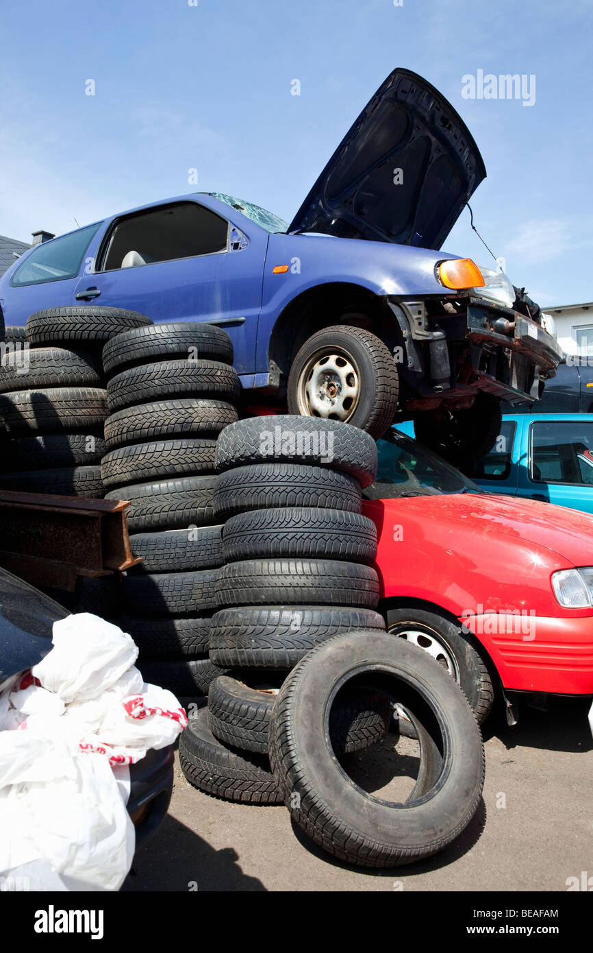 Cars and tires in a junkyard Stock Photo Alamy