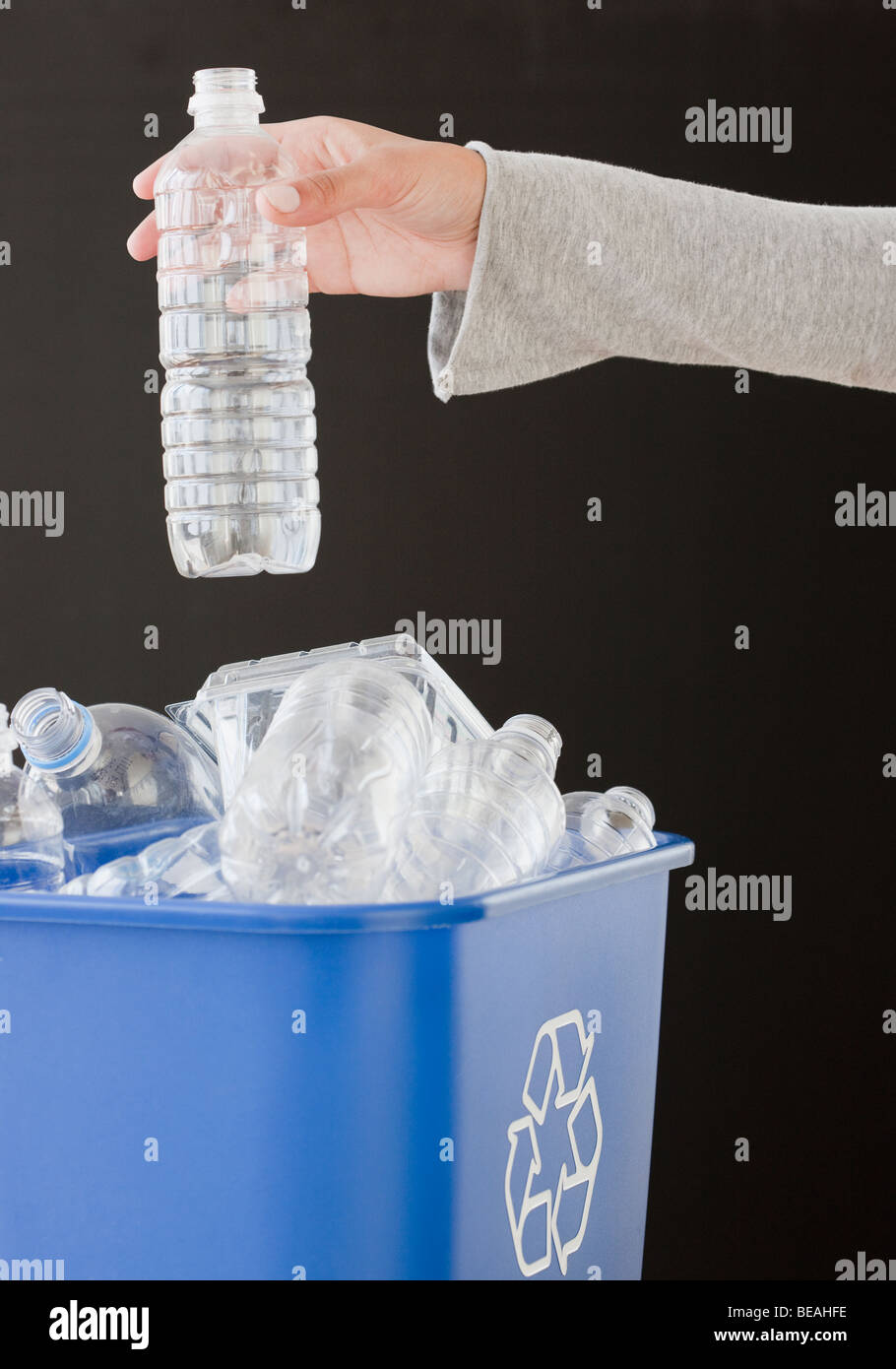 Woman recycling plastic bottle Stock Photo