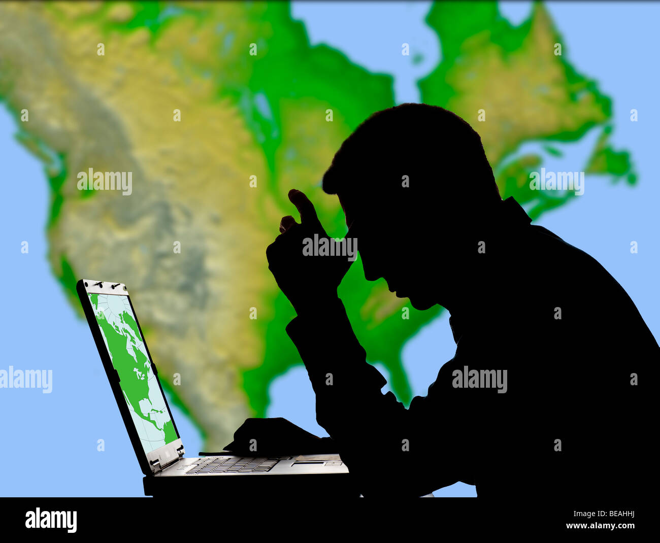 geographical artist studying NASA map on computer screen Stock Photo