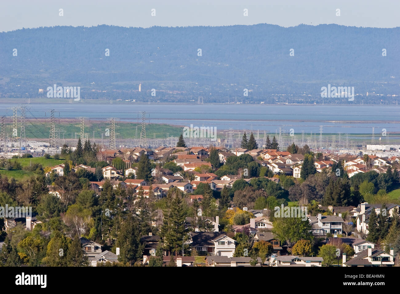 Homes, power lines and nature intersect across the San Francisco Bay from Stanford University. Stock Photo