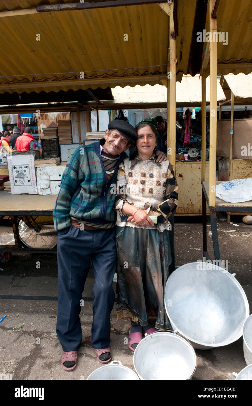 Husband and wife selling aluminium pots and pans at market in Ploiesti Romania Stock Photo