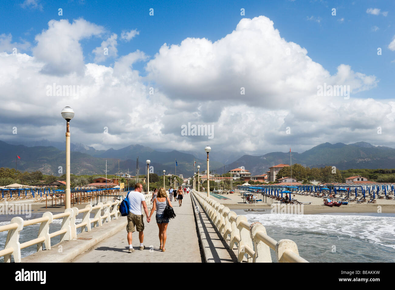 Pier at Forte dei Marmi looking towards the mountains and resort centre, Tuscan Riviera, Tuscany, Italy Stock Photo