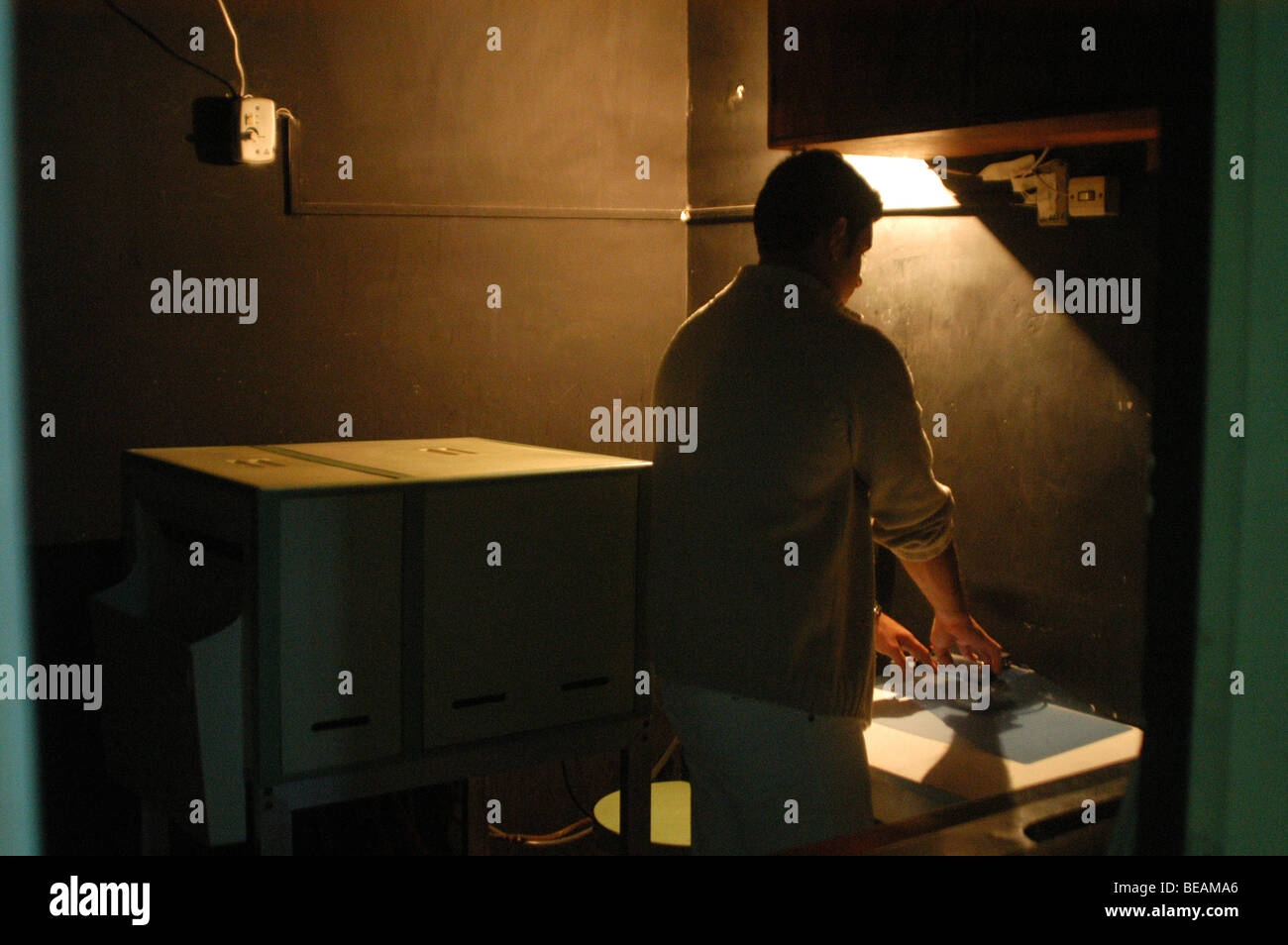 A male X Ray technical nurse working on X ray dark room. In Votorantim, city near São Paulo