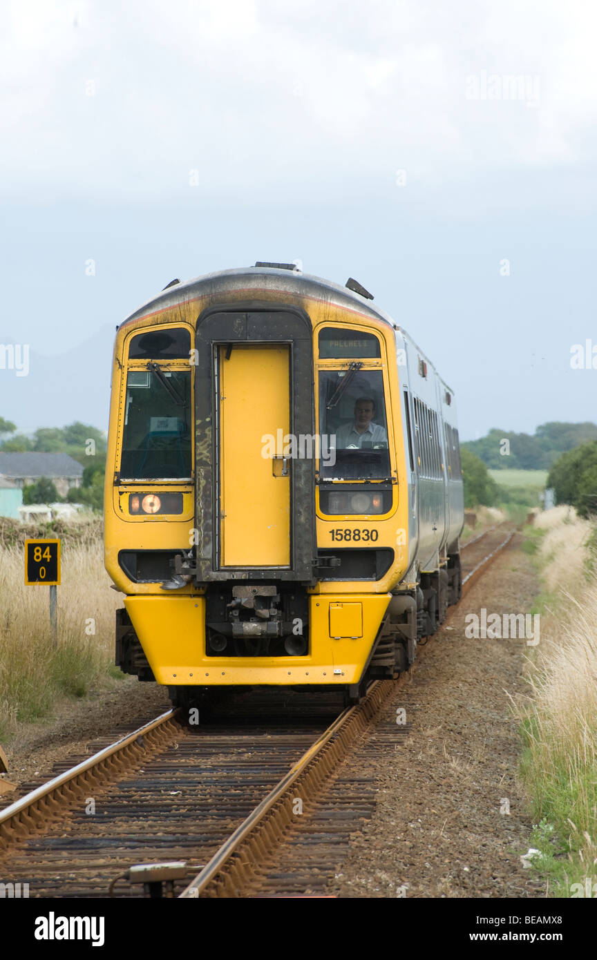Class 158 train in Arriva Train Wales livery bound for Pwllheli on the welsh Cambrian coast line, Wales. Stock Photo