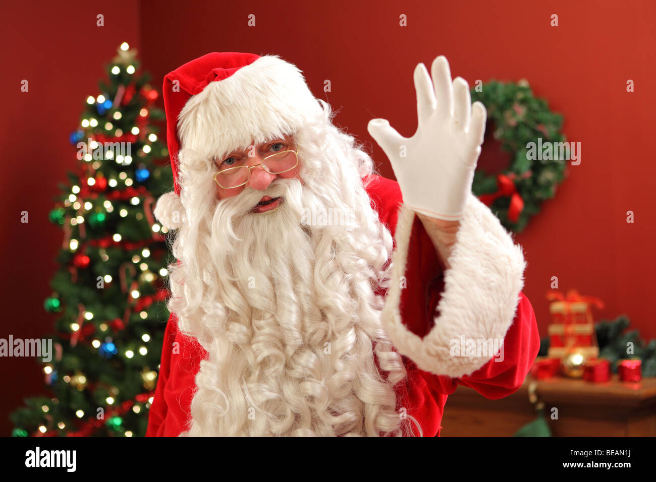 Santa Claus waving at camera Stock Photo