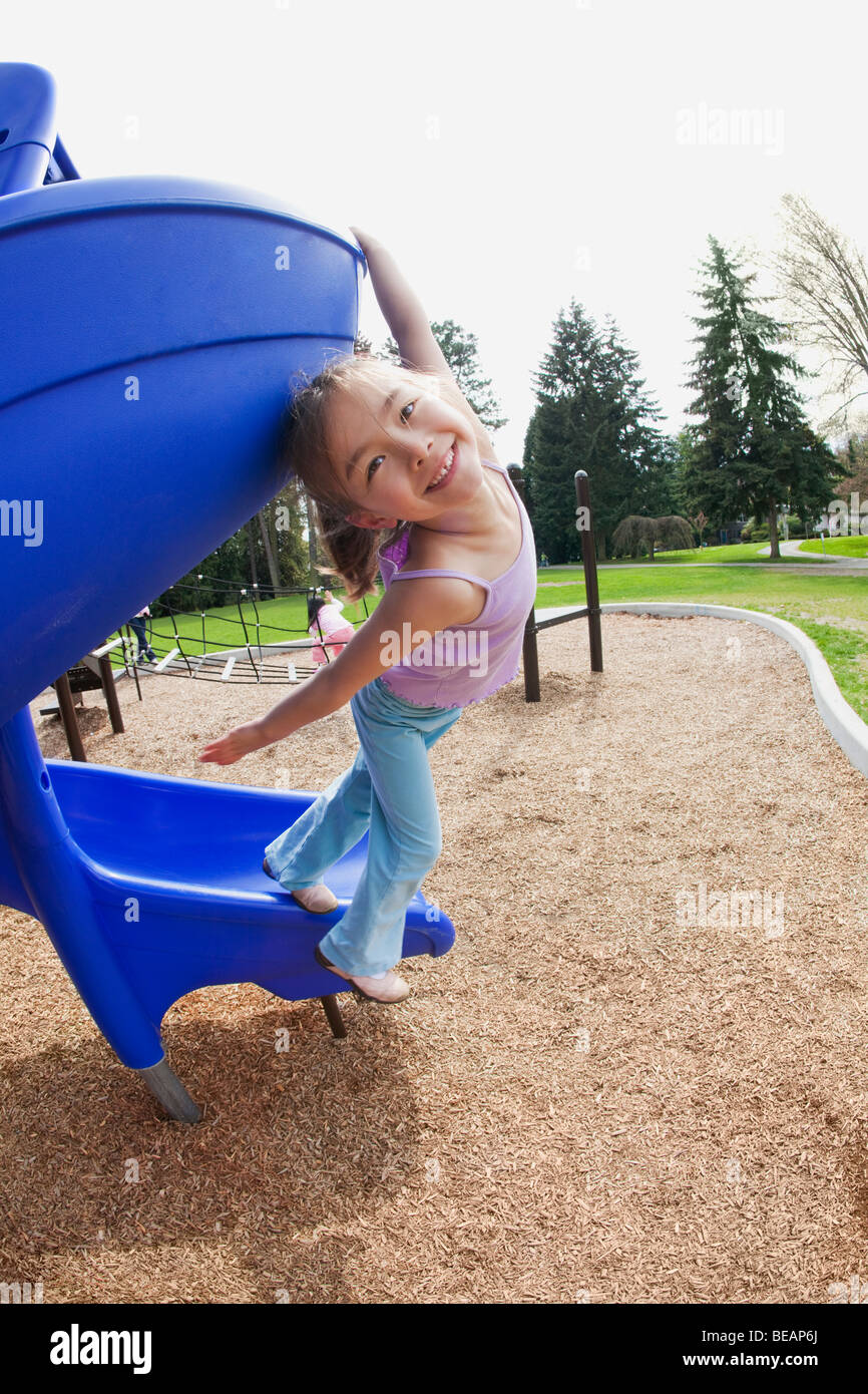 Mixed race girl at playground Stock Photo