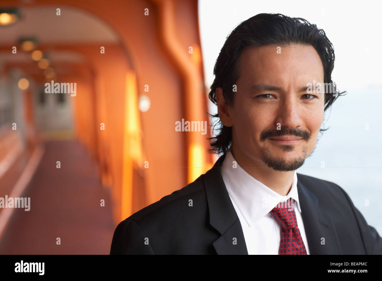 Smiling mixed race businessman Stock Photo