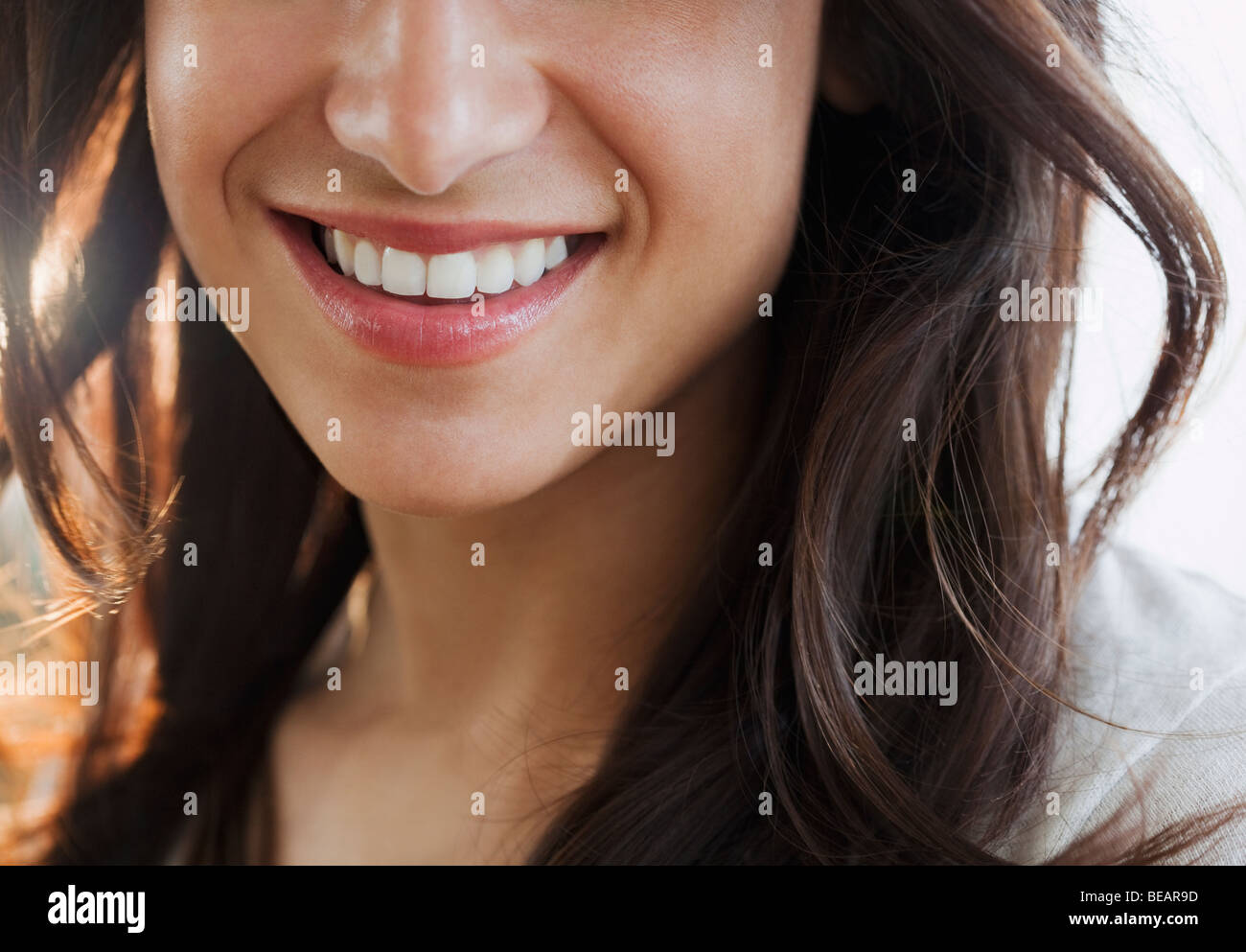 Close up of Hispanic woman's smile Stock Photo