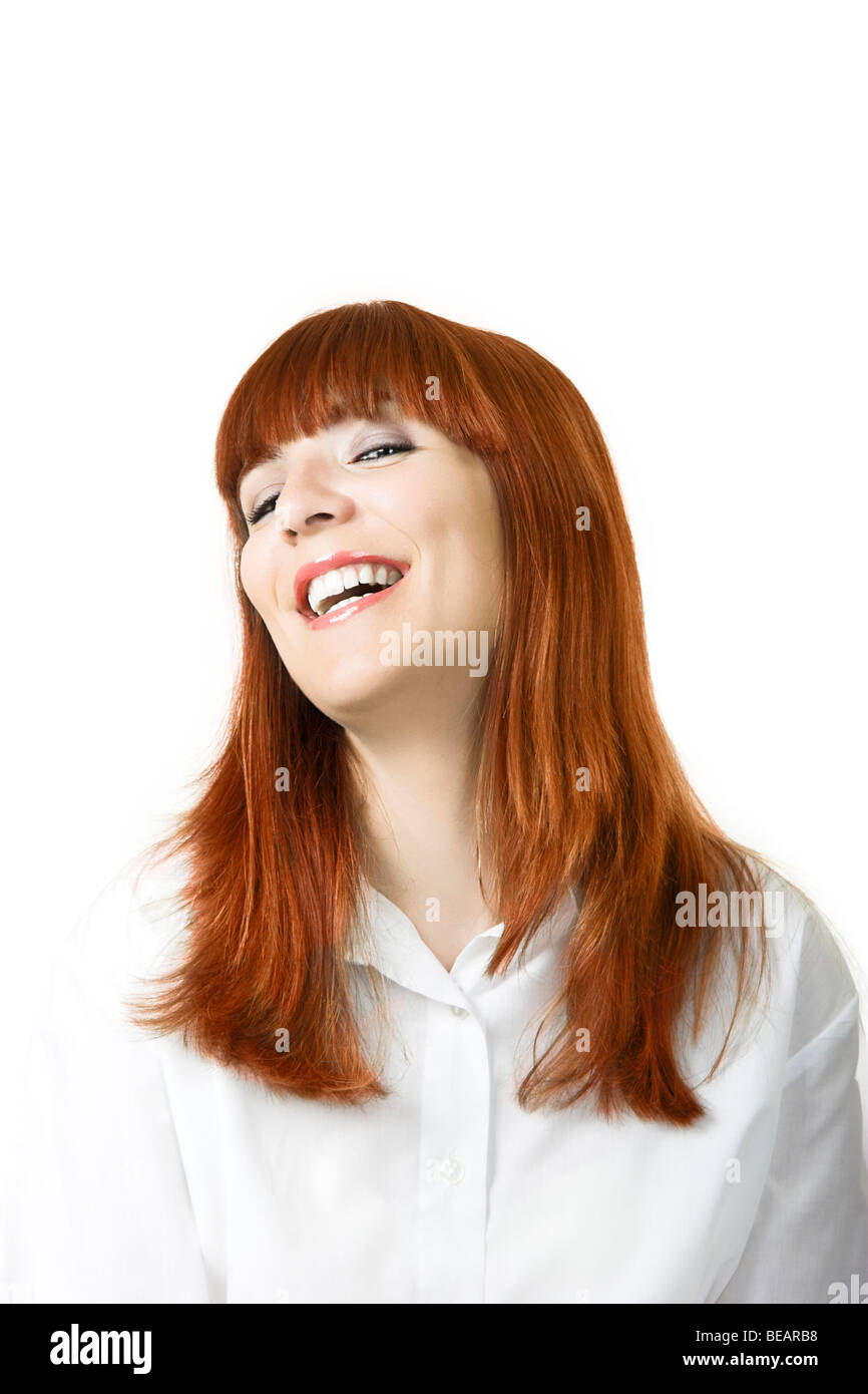 Portrait of a young beautiful woman with red hair laughing Stock Photo ...