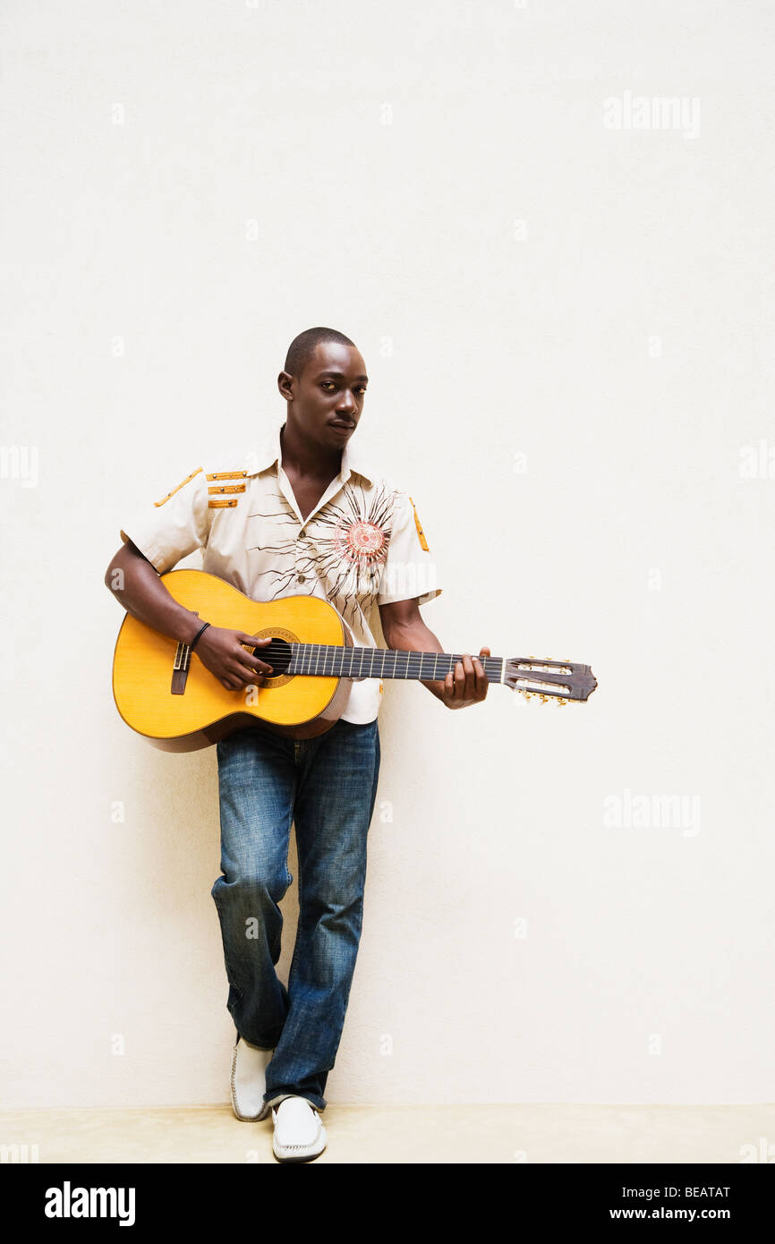 African man playing guitar Stock Photo - Alamy