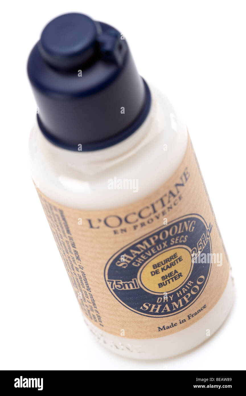 Plastic bottle of L'Occitane Dry Hair shampoo Stock Photo