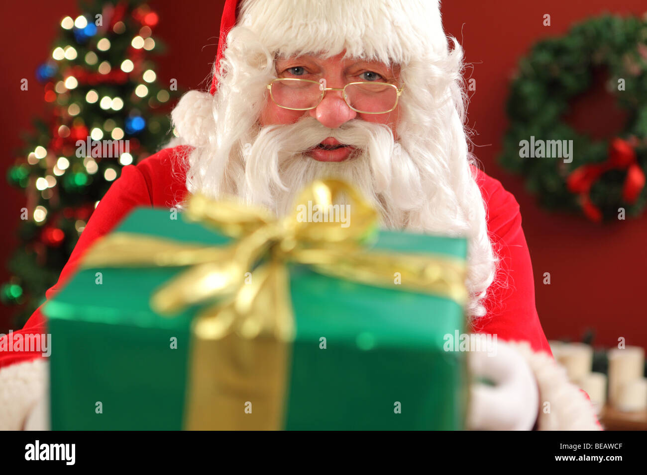 Santa Claus giving gift Stock Photo