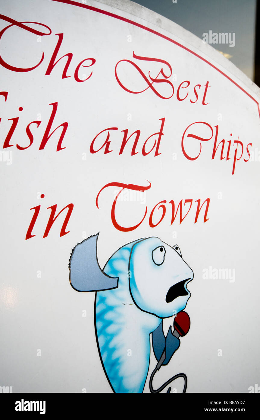Fish and chips restaurant sign, Brixham, Devon, UK Stock Photo