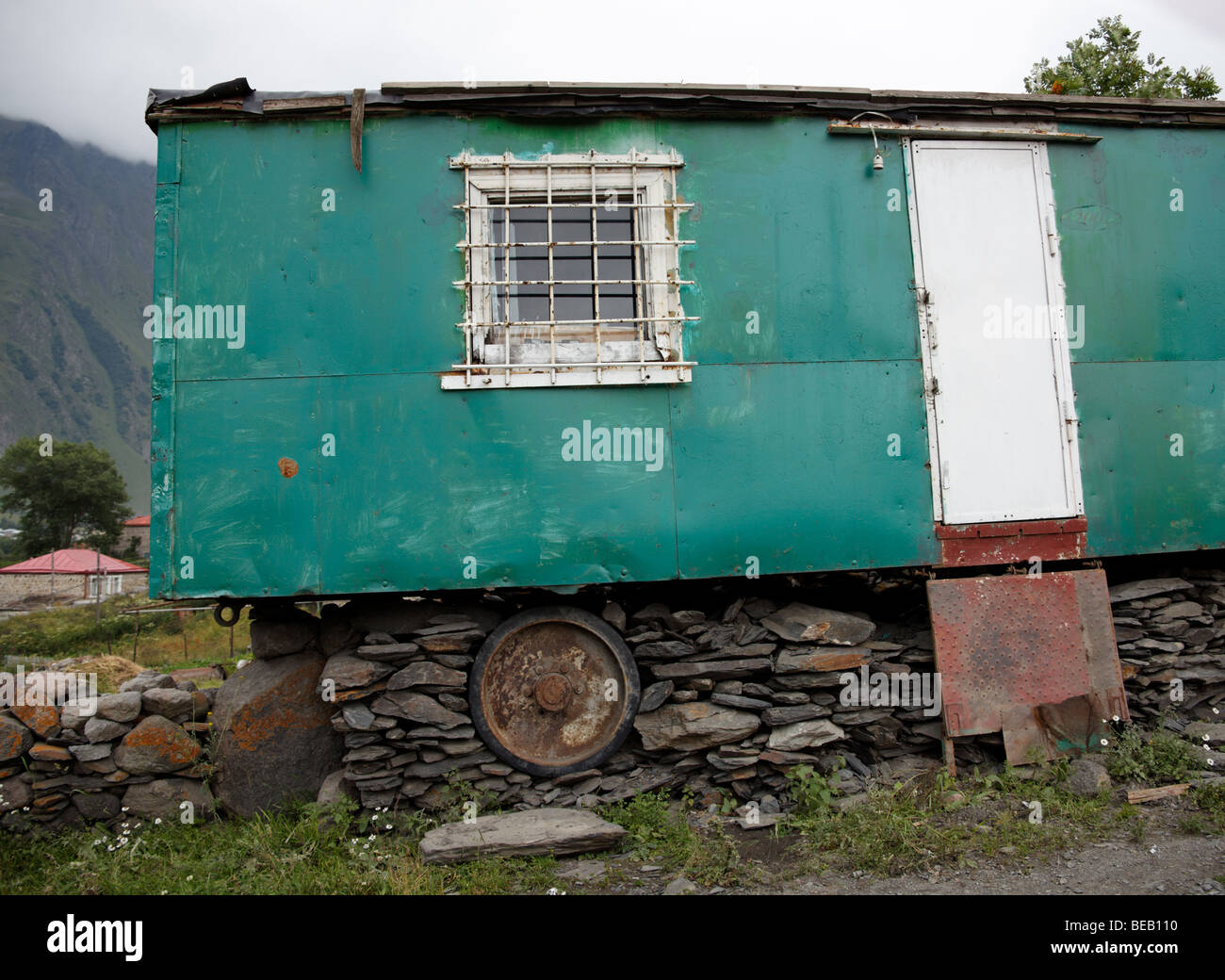 Rolling stock adapted for permanent accommodation (Kazbegi, Caucasus Mountains) Stock Photo