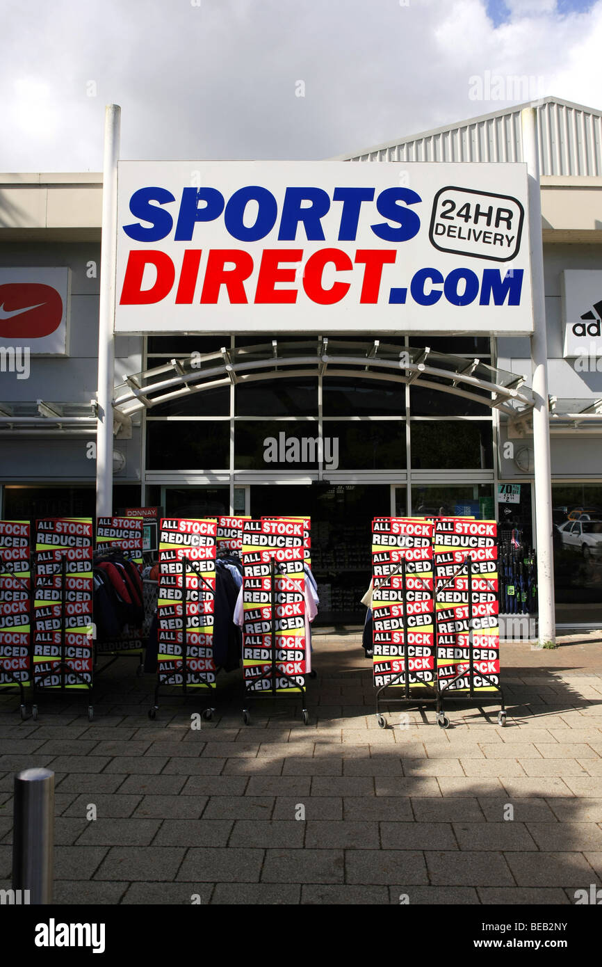 Sports Direct .com Sporting goods store and overhead sign Stock Photo